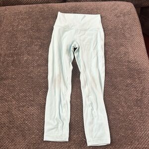 Woman size 4, teal athletic leggings